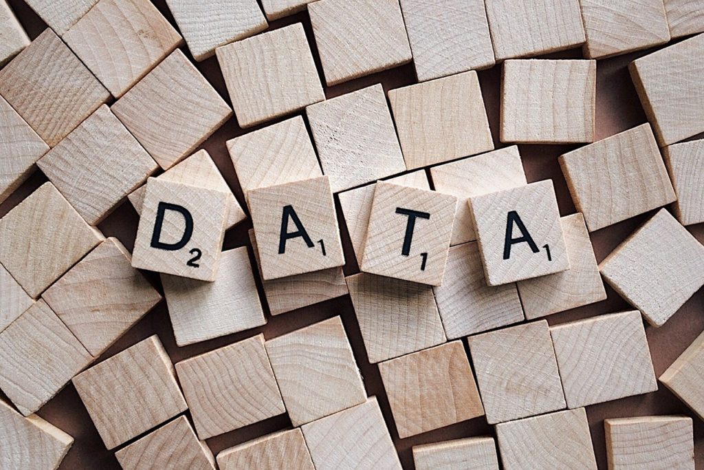 Small wooden blocks with 4 of them spelling the word DATA
